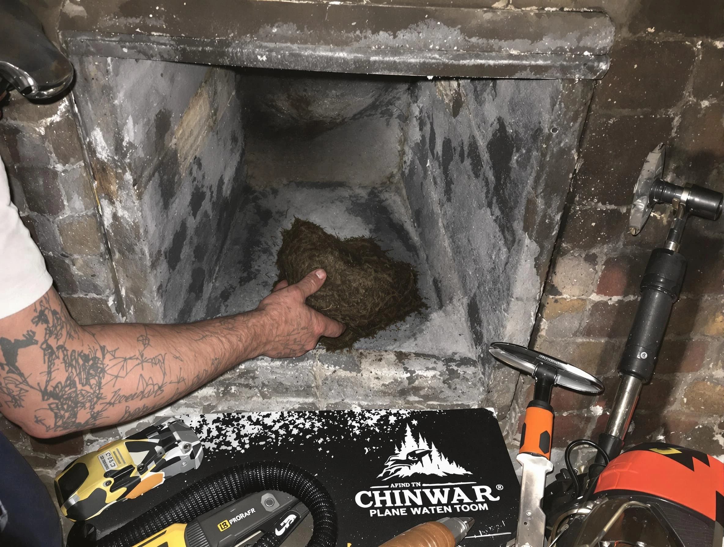 Franklin Chimney Sweep safely removing debris and screening chimney in Franklin, MA